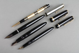 An Art Deco style engine turned gilt propelling pencil, a black Parker Duofold and Black Parker Slimfold fountain pen and 1 other