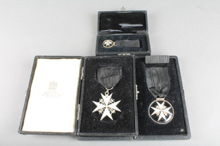 A Venerable Order of St John of Jerusalem, an Officer's breast badge, together a Serving Brothers breast badge and ditto miniature