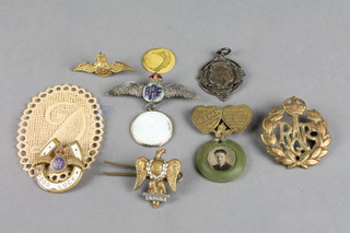 A Sutton MCC silver sports medallion and minor military and other badges
