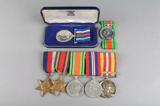 A World War Two group comprising 1939-45 and Burma Stars, Defence medal, British War medal and a silver Voluntary Medical Service medal and bar to Philip F Churchill, a Defence medal and a Civil Defence medal cased