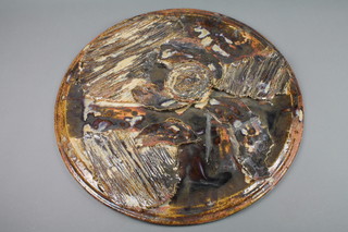 A 1970's slip glazed ceramic platter of abstract form 18"
