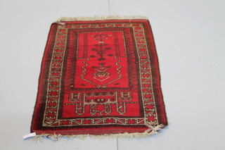 An Afghan red ground prayer rug 52 1/2" x 30"