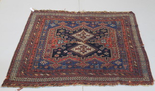 A Caucasian rug with 2 diamonds to the centre, hole to the centre, 63" x 59" 
