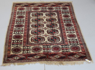 A white ground Bokhara rug with 10 octagons to the centre 72" x 49" 