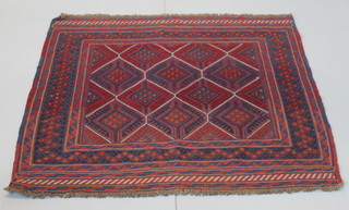 A Tribal Gazak red ground rug with stylised diamonds to the centre 54" x 49"