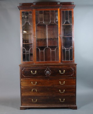 A Victorian mahogany break front secretaire bookcase with associated moulded cornice, the upper shelved section enclosed by astragal glazed doors, the base fitted a secretaire drawer above 3 long drawers, raised on a platform base 92"h x 49"w x 19"d 