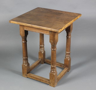 A square oak occasional table raised on turned and block supports with box frame stretcher 30"h x 24"w x 24"d
