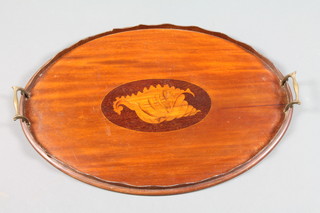 An Edwardian oval mahogany twin handled tea tray inlaid a shell 22"