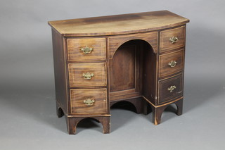 A Georgian inlaid mahogany bow front kneehole pedestal desk, the pedestal fitted a cupboard flanked by 6 long drawers, raised on bracket feet 30"h x 37 1/2"w x 19 1/2"d  