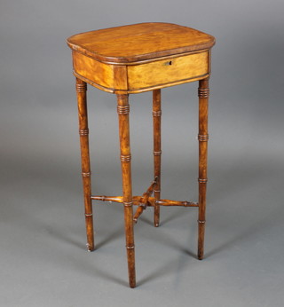 A Regency satinwood D shaped work table with hinged lid and crossbanded top, raised on ring turned legs with X framed stretcher 29"h x 15"w x 14"d