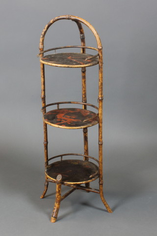 A bamboo and lacquered circular 3 tier cake stand 33"h x 10"diam. 