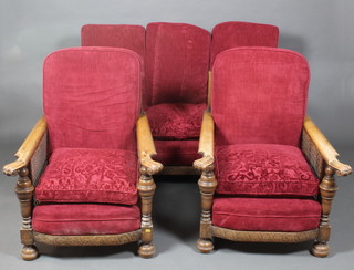 A 1930's Ercol carved oak single cane 3 piece bergere suite comprising sofa and 2 matching armchairs with carved vinery decoration 