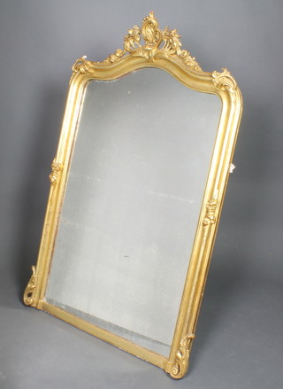 A 19th Century arch shaped plate mirror contained in a gilt painted plaster frame 54"h x 34"w 