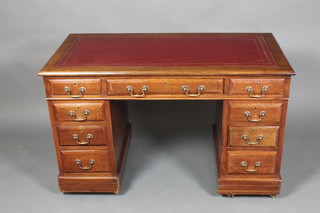 A Victorian mahogany desk with inset red leather skiver above 1 long and 8 short drawers 27"h x 48"w x 25"d