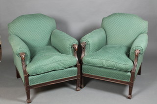 A handsome pair of Edwardian mahogany Adam style armchairs with show frame rams head decoration, raised on square tapering supports