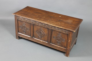A 1930's 17th Century style carved oak coffer with panelled front and hinged lid 20"h x 46"w x 19"d