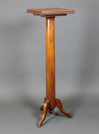 A Victorian mahogany torchere with square top, raised on a turned column and tripod base 47 1/2"h x 14"w x 14"d 