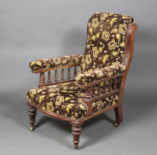 A Victorian mahogany armchair upholstered in brown sculptured dralon with bobbin turned decoration, on turned legs 