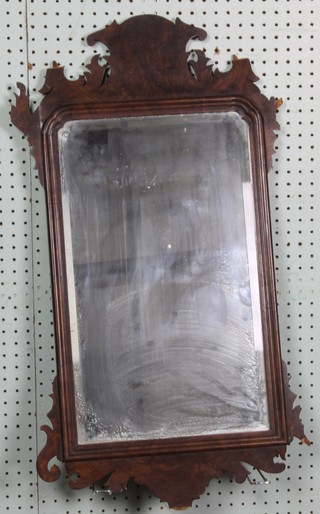 A rectangular shaped bevelled plate Chippendale style mirror 30" x 17"