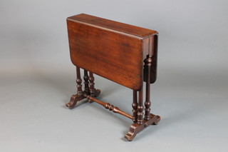 A Victorian mahogany Sutherland table raised on pillar supports 26"h x 5" closed, when open 31"w x 26"d