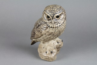 A 1960's tan glazed figure of a seated owl by Barbara Lindley Adams 7" 