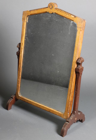 A Victorian aesthetic movement toilet mirror contained in an inlaid oak frame, raised on a carved oak stand 37"h x 24 1/2"w