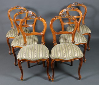 A set of 6 Victorian style satinwood balloon back chairs with shaped mid rails, the seats of serpentine outline, raised on cabriole supports