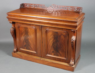 A Victorian mahogany chiffonier with pierced raised three-quarter gallery, fitted a drawer above a double cupboard, raised on scroll supports and platform base 44"h x 53"w x 21"d