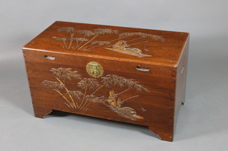 A carved camphor coffer with hinged lid on bracket feet 22 1/2"h x 40"w x 19"d 