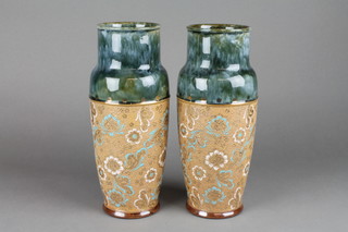 A pair of Royal Doulton over form vases with blue green shoulders and band of incised floral decoration 10" 