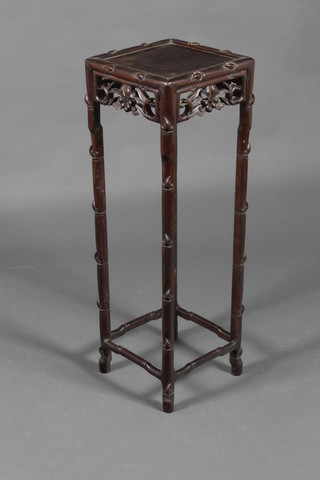 A square Chinese Padouk jardiniere stand with pierced apron raised on turned legs 35 1/2"h x 11 1/2"w x 12"d