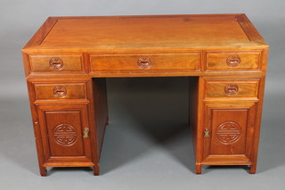 A Chinese Padouk pedestal desk fitted 1 long and 2 short drawers, the pedestal fitted a drawer above cupboard 31"h x 50"w x 26"d 
