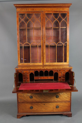 A George III inlaid mahogany secretaire bookcase, the upper section with moulded cornice, the interior fitted adjustable shelves enclosed by astragal glazed doors, the base fitted a secretaire drawer above 3 long drawers with brass drop handles and escutcheons, raised on bracket feet 87"h x 43"l x 22 1/2"d 