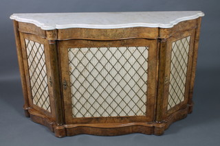 A Victorian figured walnut chiffonier of serpentine outline with white veined marble top, the base fitted 3 cupboards enclosed by grilled panelled doors and with columns to the sides 35 1/2"h x 60"w x 15 1/2"d 