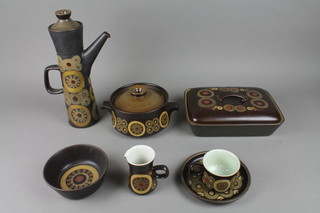 A 1960's Denby tea, coffee and dinner service decorated in the Arabesque pattern comprising a teapot, coffee pot and hotwater jug, 2 rectangular tureens and covers, 5 small soup bowls and covers, a round tureen and cover, 6 soup bowls, 8 tea cups and 8 saucers, 8 coffee cups and saucers, 12 side plates, 4 dinner plates, 8 oval plates, 6 egg cups, a mustard pot, a salt and pepper, a small jug, sauce boat and stand and bowl 