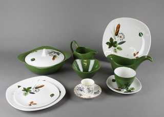 A Mid Winter tea and dinner service comprising 6 tea cups, 6 saucers, 12 side plates, 7 dinner plates, a tureen and cover, saucer boat, bowl and cream jug, a Royal Doulton coffee set decorated with floral sprays
