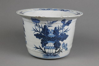 A 19th Century Chinese blue and white jardiniere with flared lip and strap work body with panels of vases of flowers 7" (f)