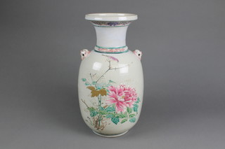 A Chinese famille rose baluster vase with waisted neck and lion head handles decorated with flowering peony and insects 15" 