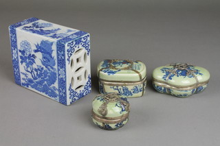 A modern blue and white Chinese pillow with pierced decoration and dragons amongst flowers, 3 modern mounted Celadon boxes