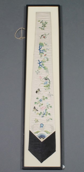 A Chinese silk work sleeve decorated with heron amongst flowers, framed
