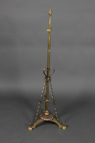 A copper and brass adjustable standard lamp
