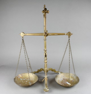 A pair of brass bank scales by Doyle & Sons 