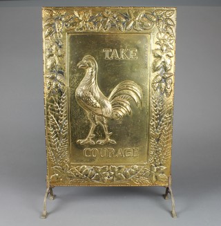 An embossed brass fire screen marked Take Courage