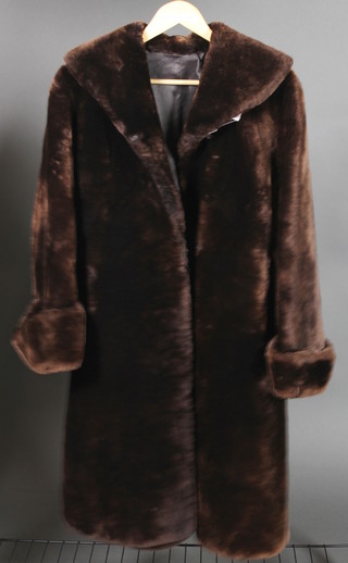 A lady's brown beaver lamb fur coat