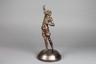 A bronze figure of a standing Don Quixote, raised on a circular base 13"