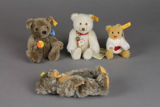A brown Steiff teddybear 5 1/2", a ditto 6", a white ditto 6" and a brown ditto 3"