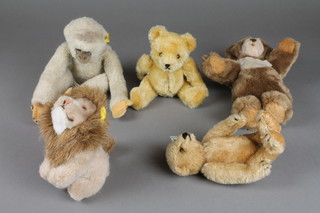 A Steiff white monkey 9", ditto brown teddybear 9", ditto brown teddybear 7" and a seated lion 5" together with a yellow Hermann teddybear 7" 