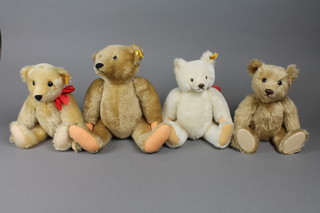 A Steiff yellow teddybear with squeaker 16", 1 other with humped back 12", a white Steiff teddybear 12" and a yellow Michele D Clise Schnuffy bear 12"
