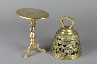 A pierced brass inkwell in the form of a bell 4 1/2" and an oval brass model of a snap top wine table 6"