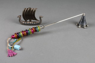 A corkscrew in the form of a Viking long boat 4" together with a chrome and glass candle snuffer
